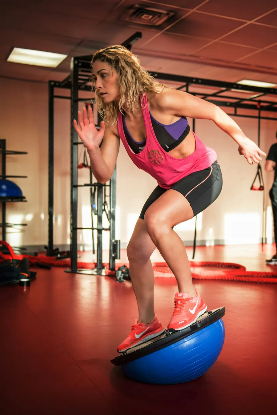 An athlete training hard in a bright studio